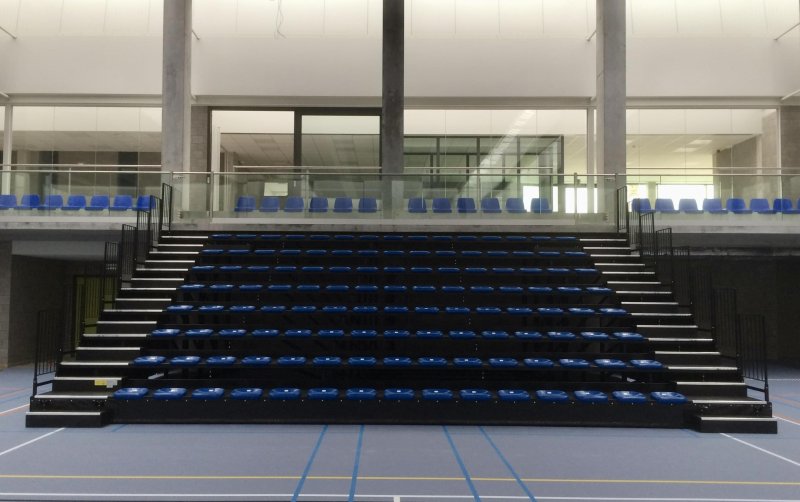 Foldable tribune to maximize space in sports field.